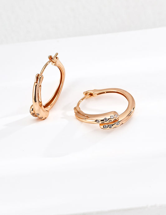 Twisted Gold Hoop Earrings with Diamond Accents
