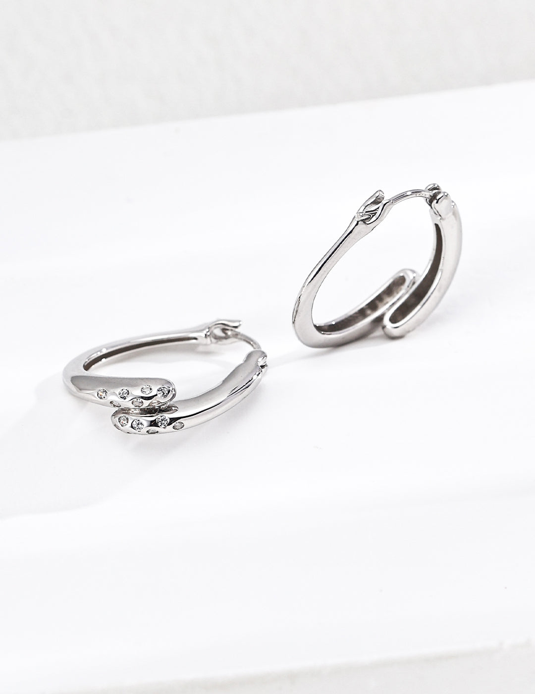 Twisted Gold Hoop Earrings with Diamond Accents