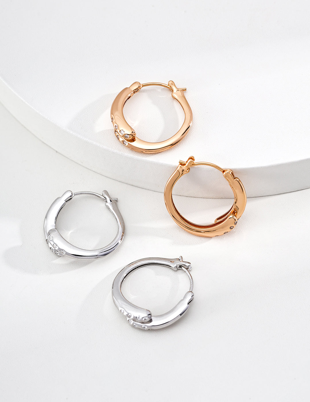 Twisted Gold Hoop Earrings with Diamond Accents